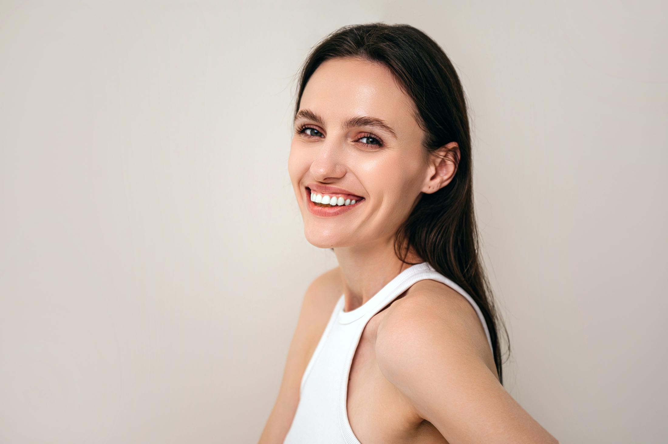 Woman in white tank top