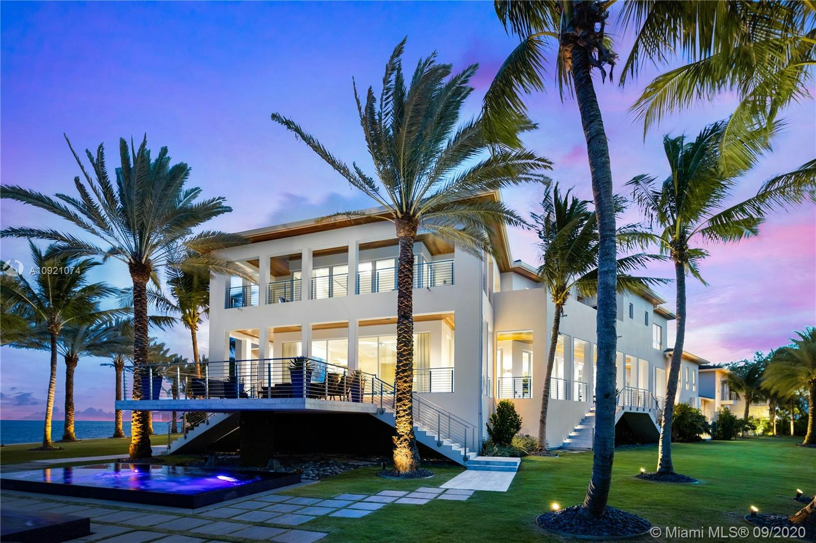 villa housing building house plant palm tree tree grass hotel mansion