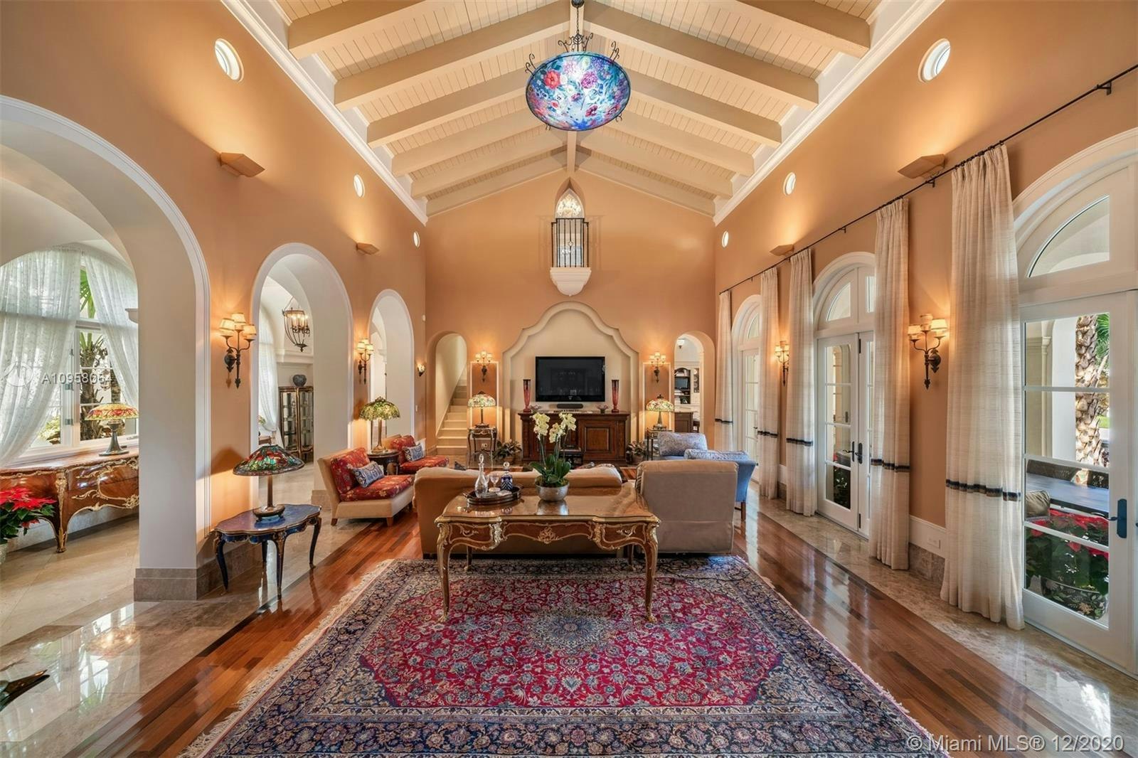 living room room indoors furniture flooring rug wood floor hardwood couch