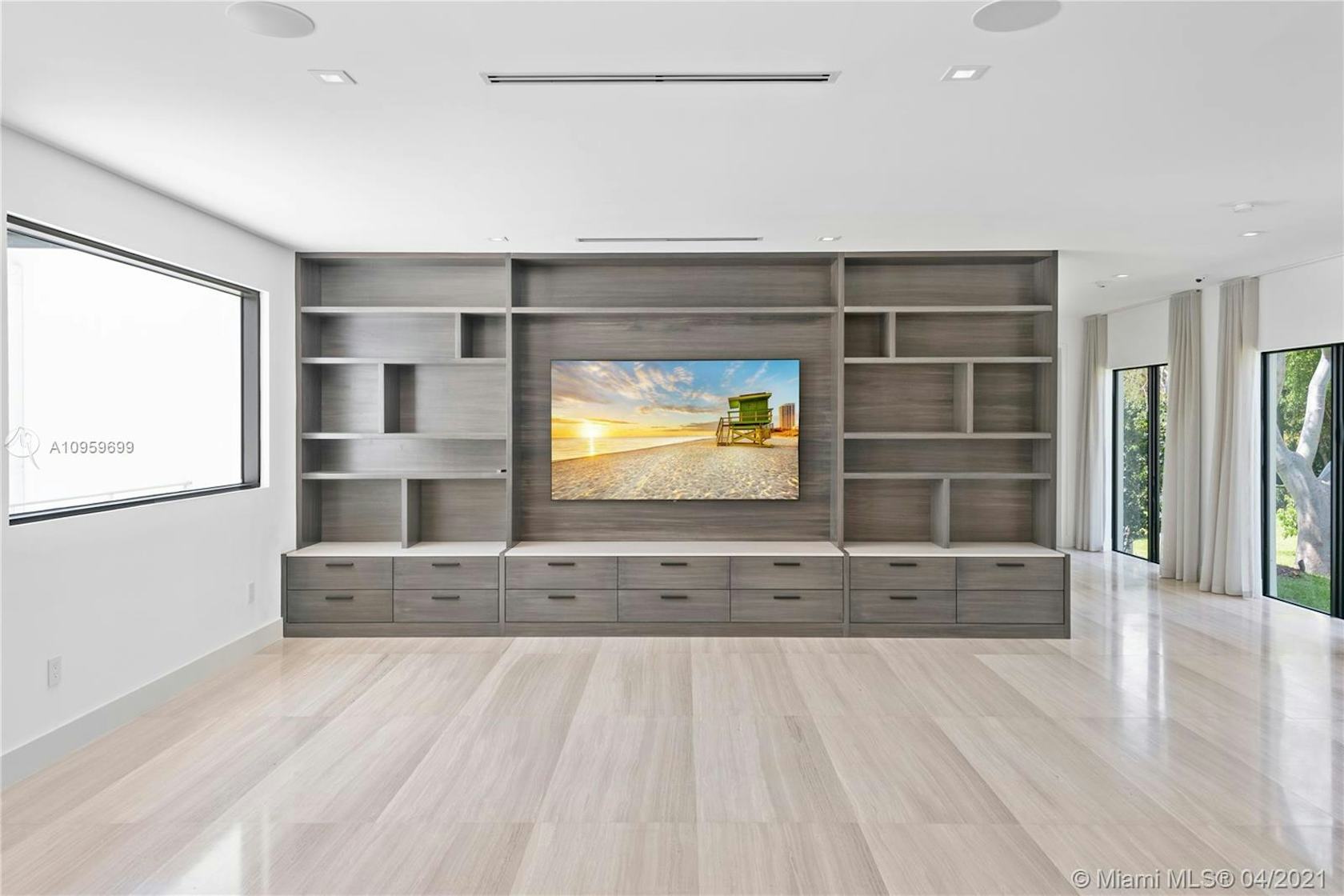 interior design indoors floor flooring room furniture living room monitor screen entertainment center