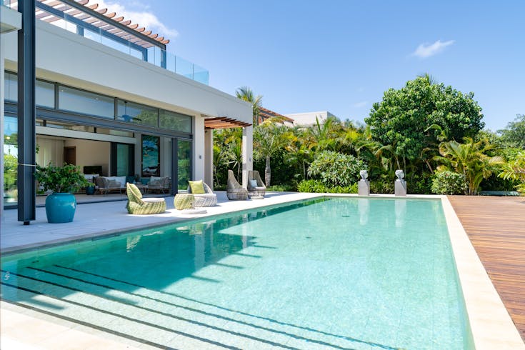 housing villa pool water swimming pool plant chair outdoors hotel resort