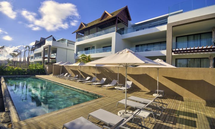 building hotel resort housing villa pool water chair swimming pool person