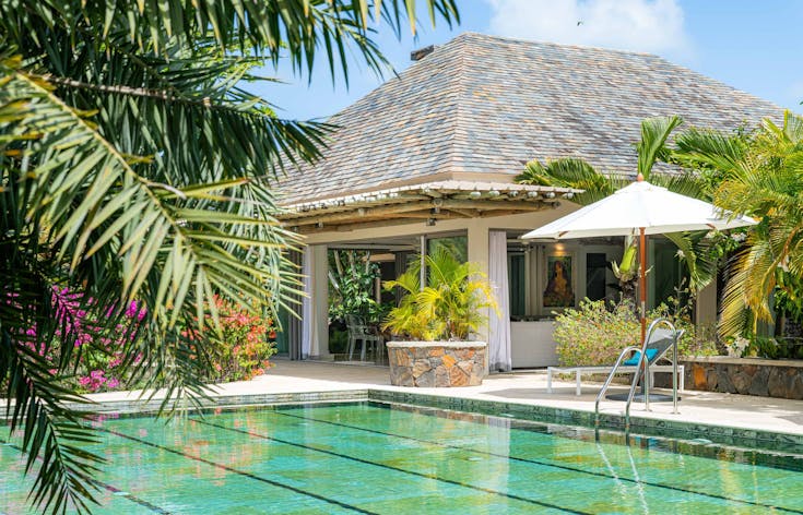 housing villa hotel resort pool water plant swimming pool chair outdoors