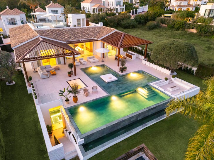 pool water swimming pool outdoors building housing villa aerial view chair furniture