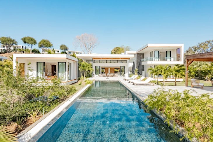 building house housing villa pool water swimming pool outdoors chair waterfront