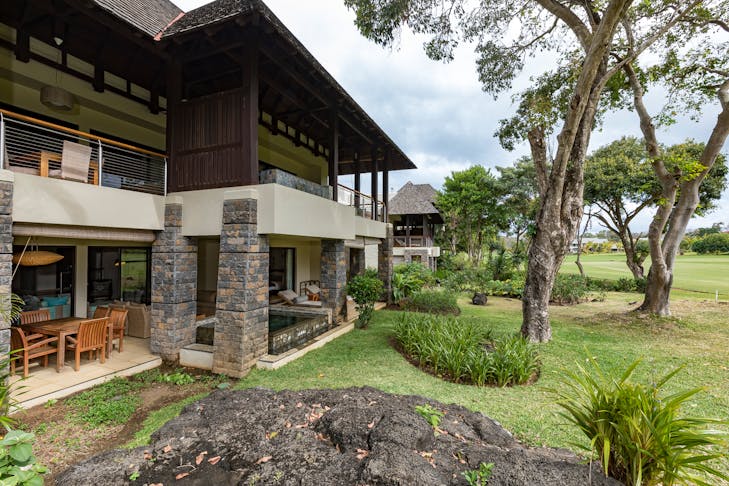 building hotel resort housing villa chair tree grass patio porch