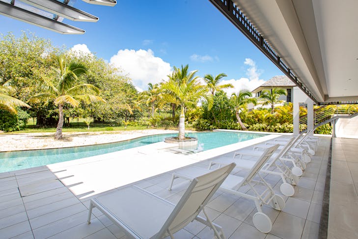 chair housing villa hotel resort pool water dining table outdoors swimming pool