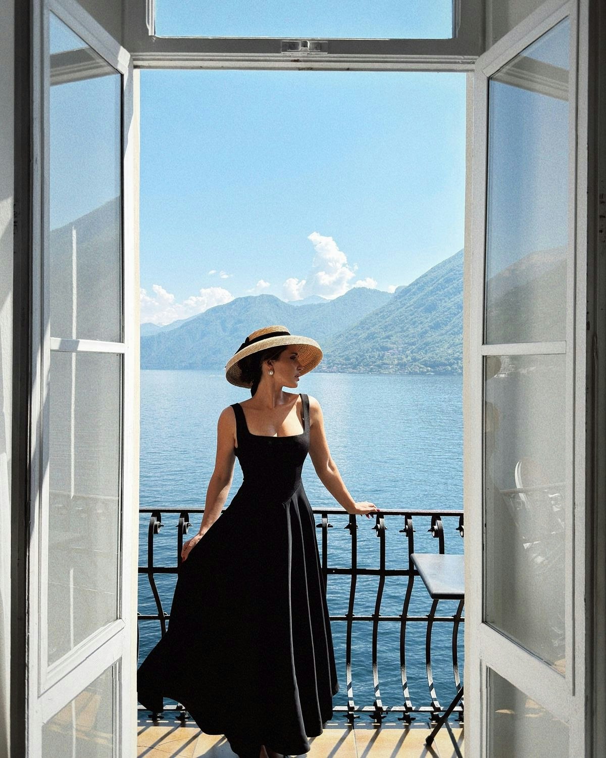 adult female person woman clothing dress hat balcony beachwear scenery