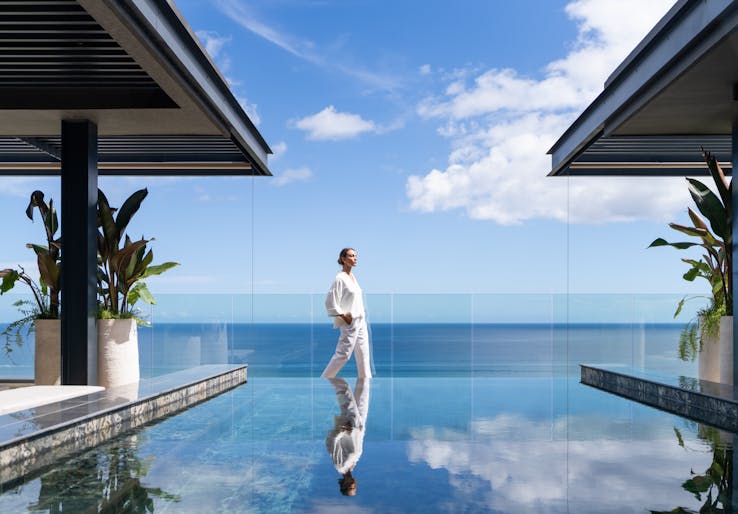 building hotel resort pool water summer waterfront swimming pool person outdoors