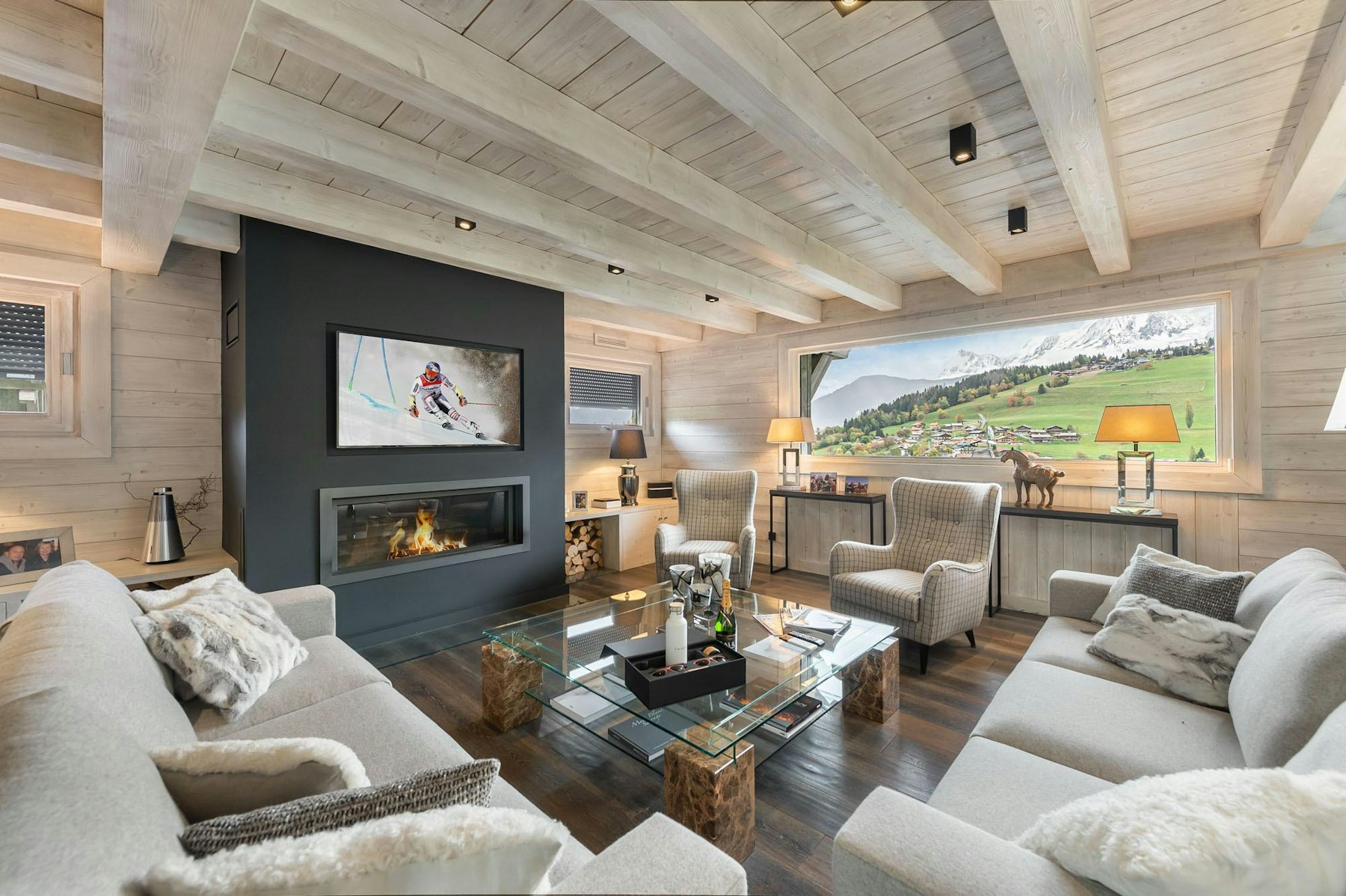 Chalet living room facing fire and valley — Megève