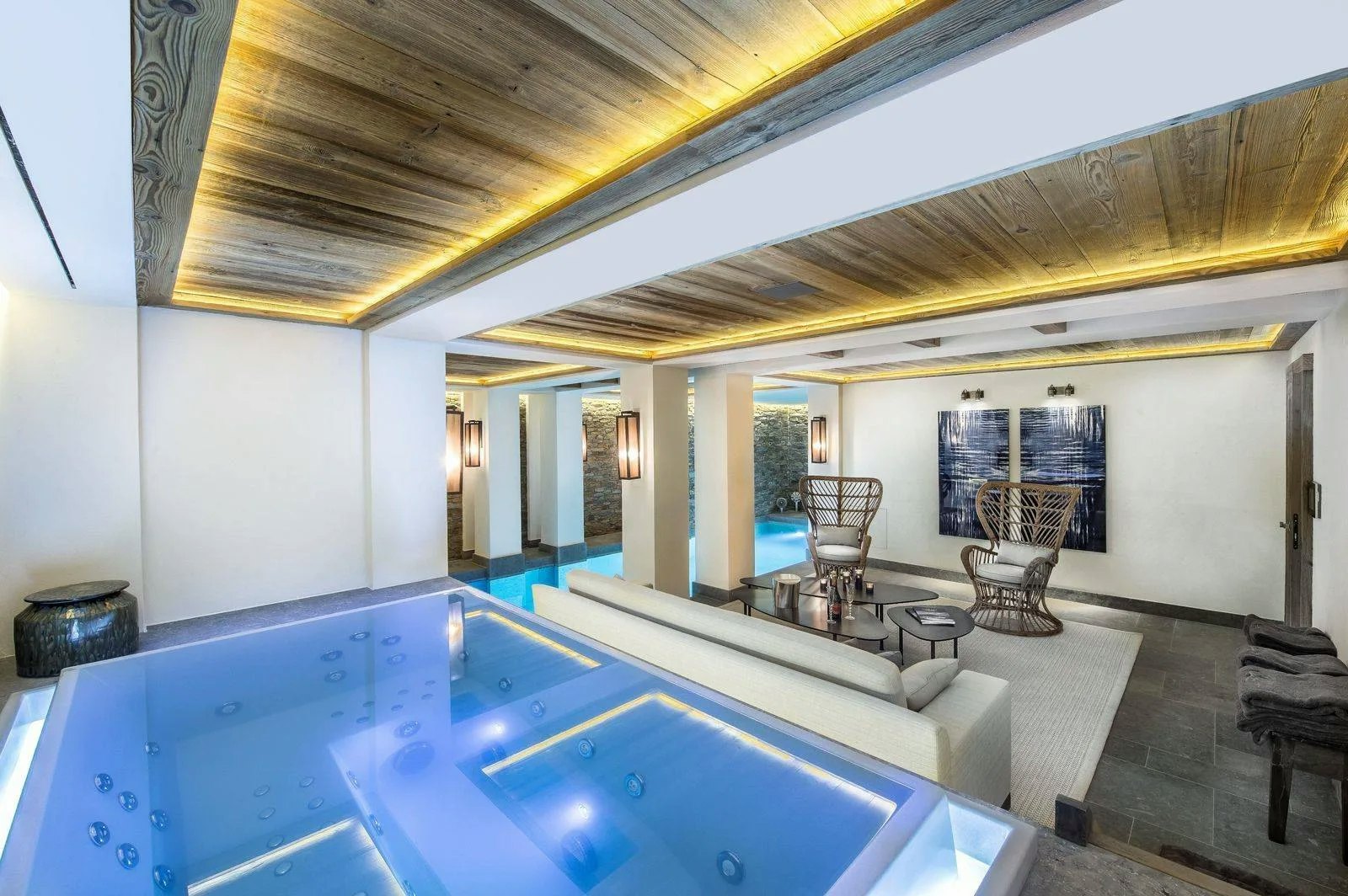 Living room of a luxury chalet in Courchevel with fireplace and mountain views
