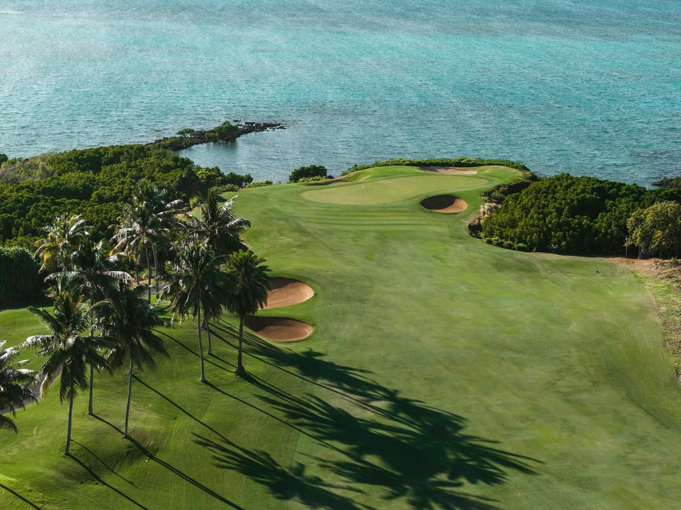 The Ernie Els golf course at Anahita facing Île aux Cerfs, Mauritius