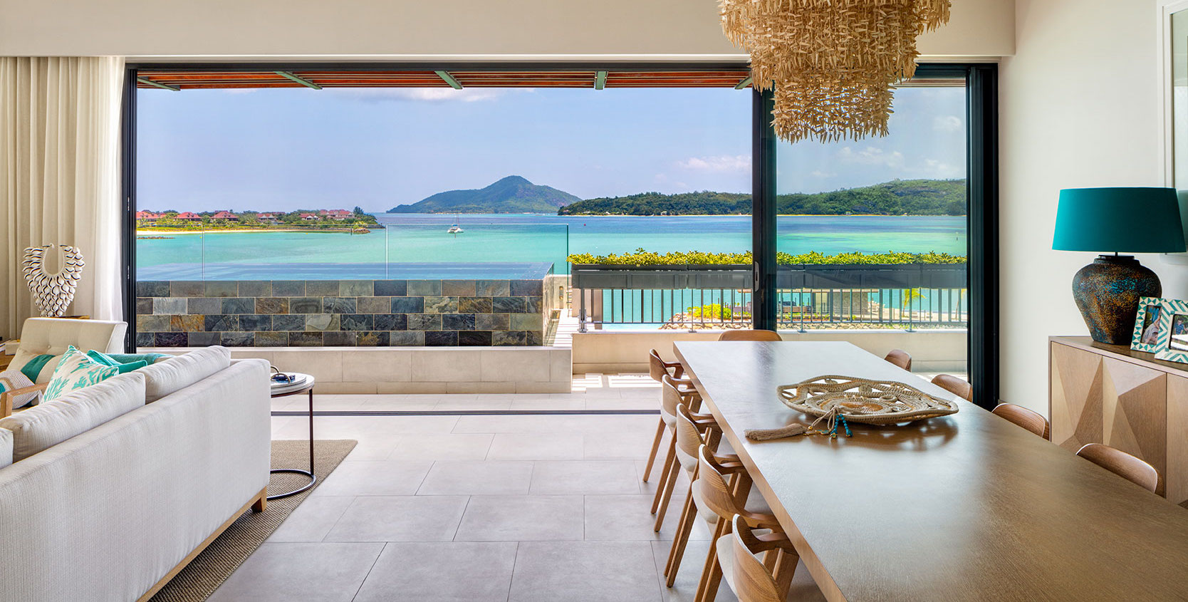 Living and dining space with sea view at Pangia Beach