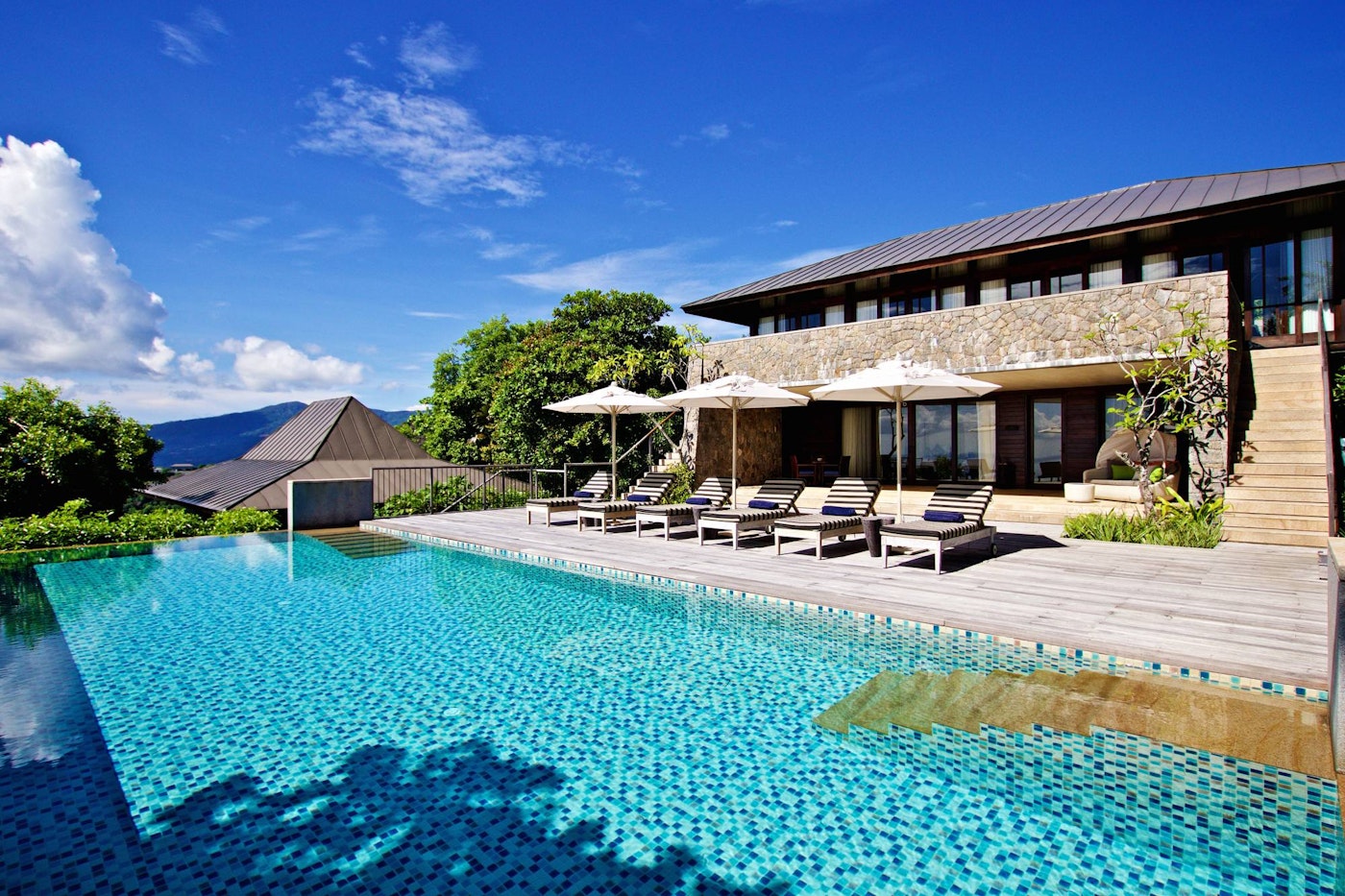 Infinity pool and teak sun deck — Four Seasons Private Residences Seychelles