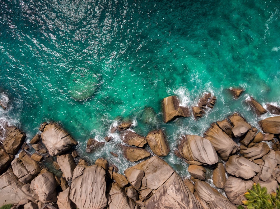 The signature granite boulders of Félicité meeting the Indian Ocean.