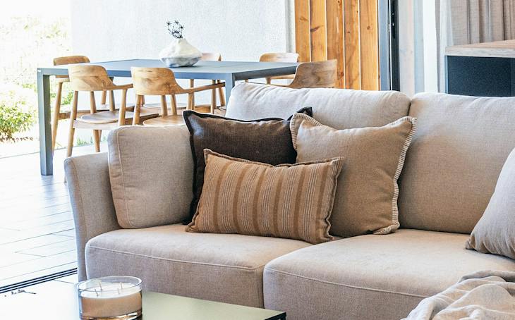 Living room of a delivered Saint Antoine Private Residence apartment, opening onto the terrace (indicative finishes)