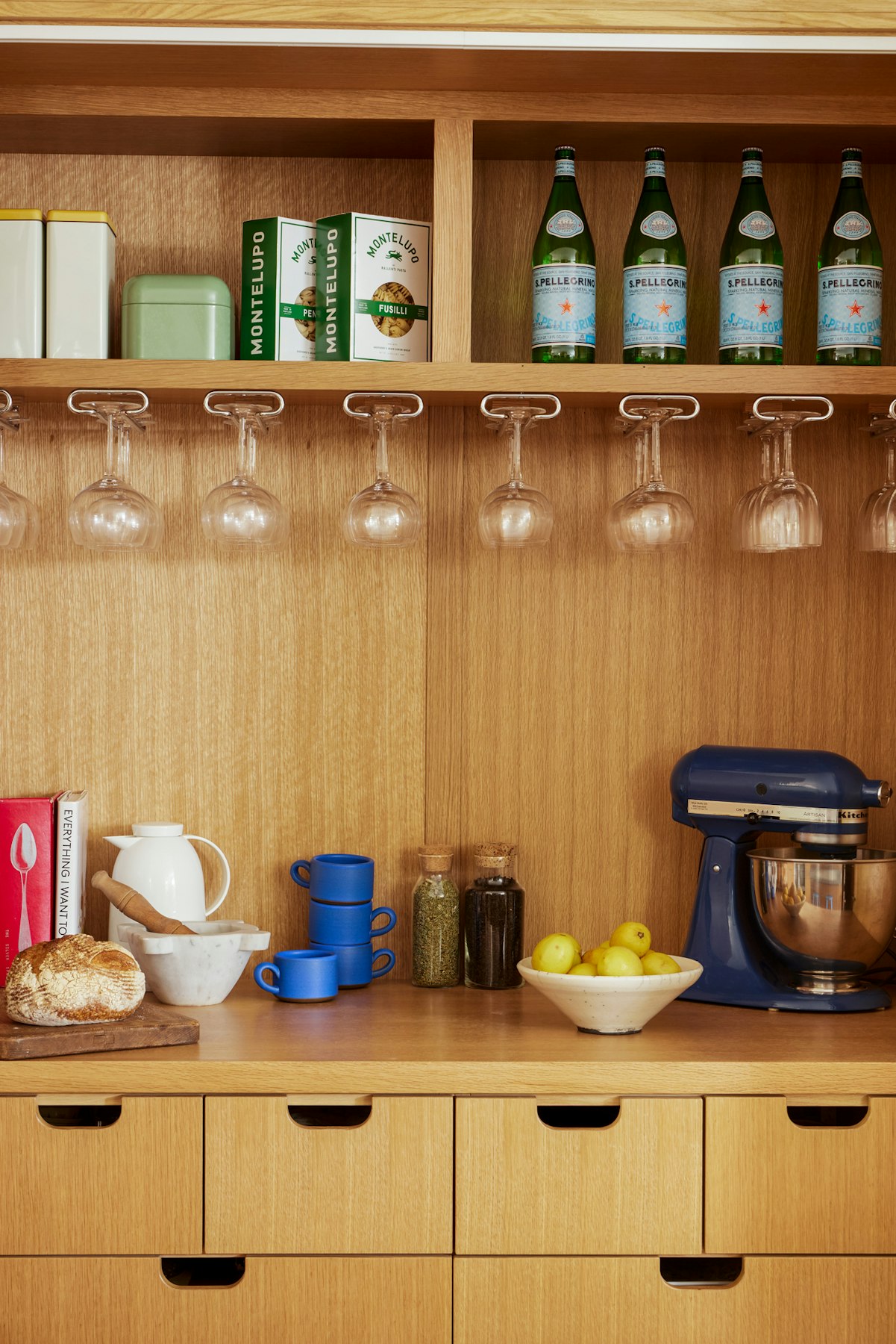 inside of pantry with stored items and appliances