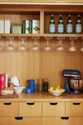 inside of pantry with stored items and appliances