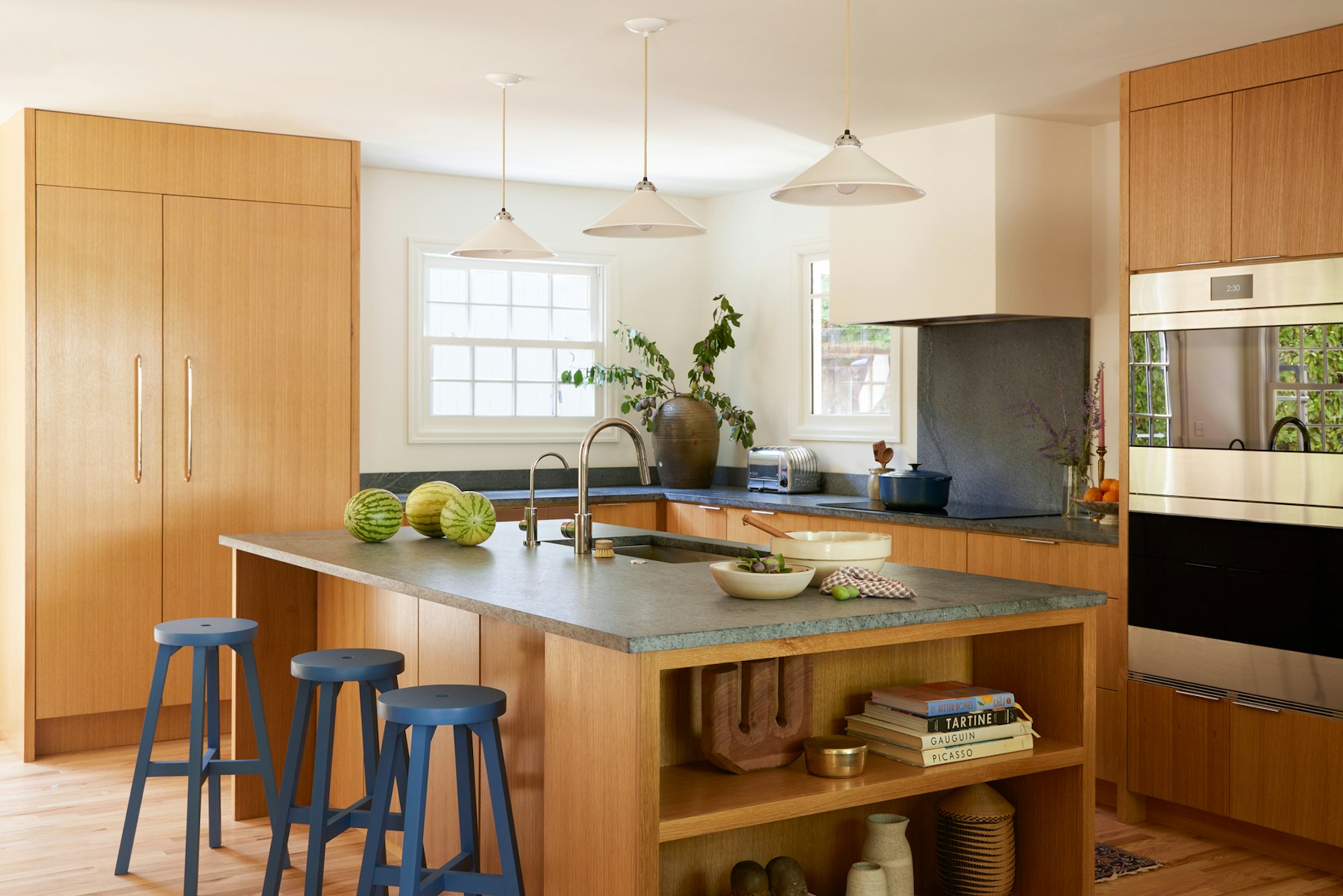 kitchen with white oak cabinets and soapstone counter