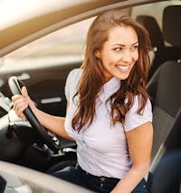 woman in the drivers seat of a car