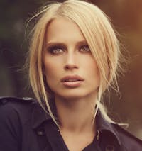 A blonde model looking off to side