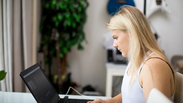 A person looks at laptop screen.