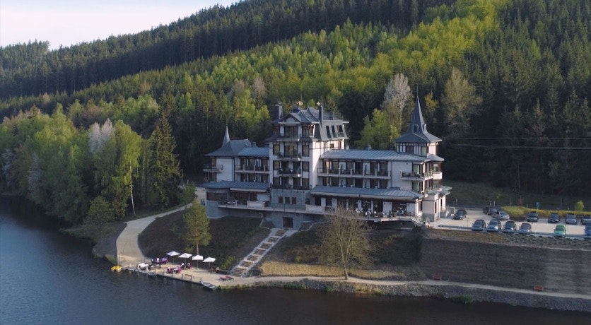 Cover Image for RETRO RIVERSIDE WELLNESS RESORT. building,hotel,resort,outdoors,land,nature,water