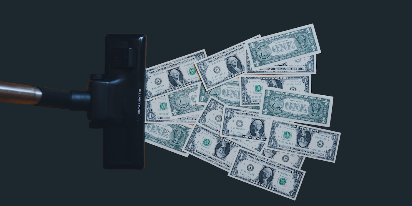 Vacuum and pile of money