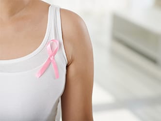Woman with pink ribbon on shirt