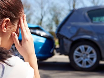 Woman at the scene of a car accident