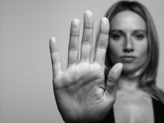 Woman with her hand held in front of her