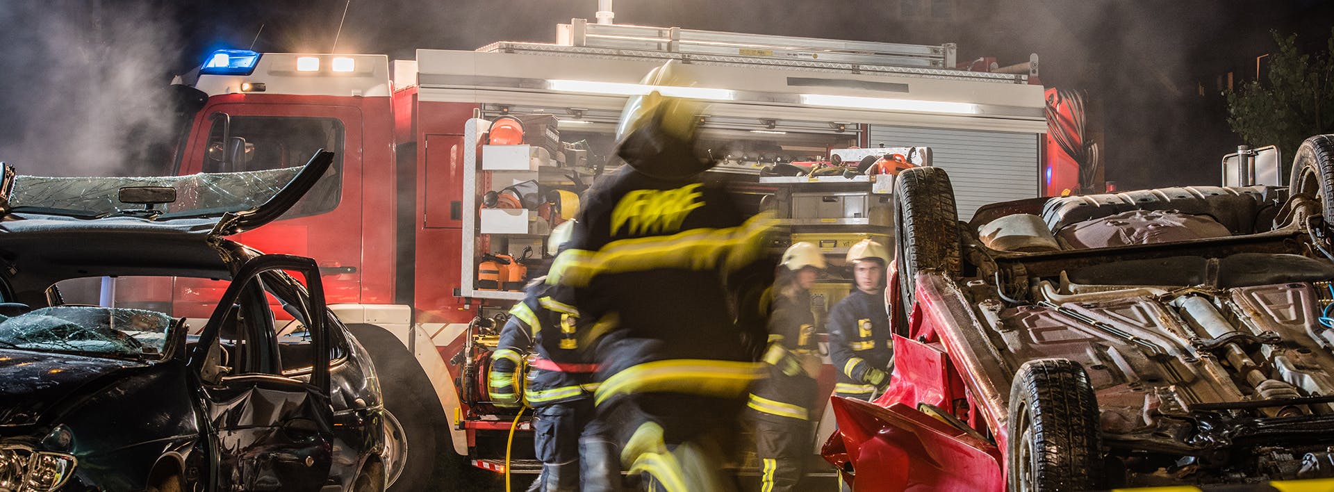 Firefighter walking to a wreck