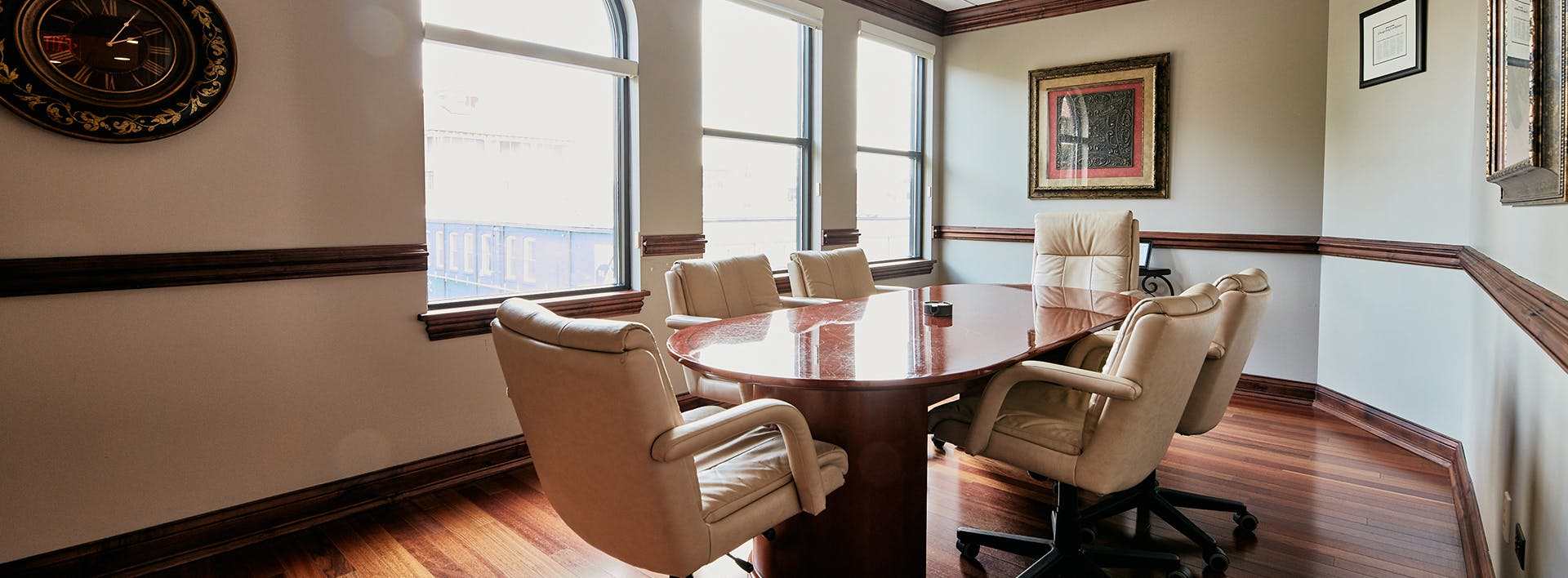 there is a large conference table with chairs in a room