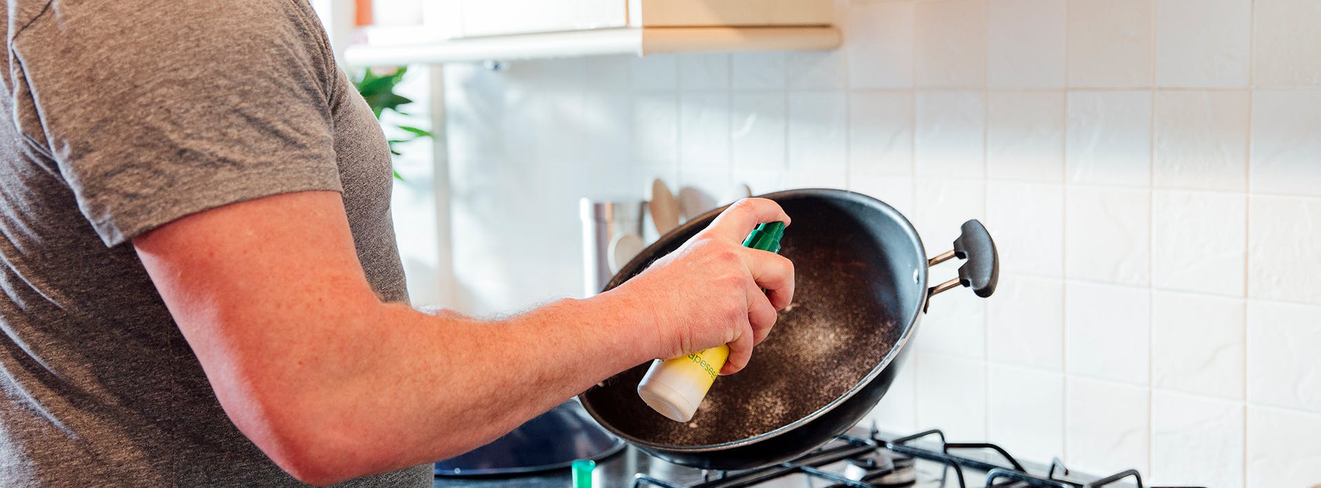someone is cooking in a pan on the stove with a spatula