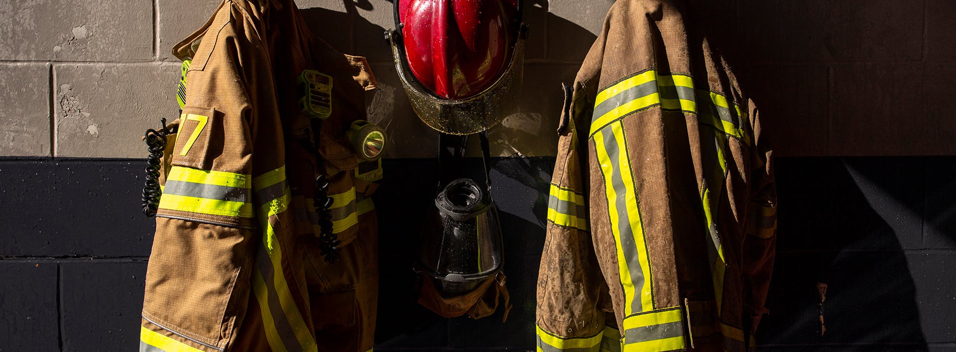 there are three fire fighters standing next to each other