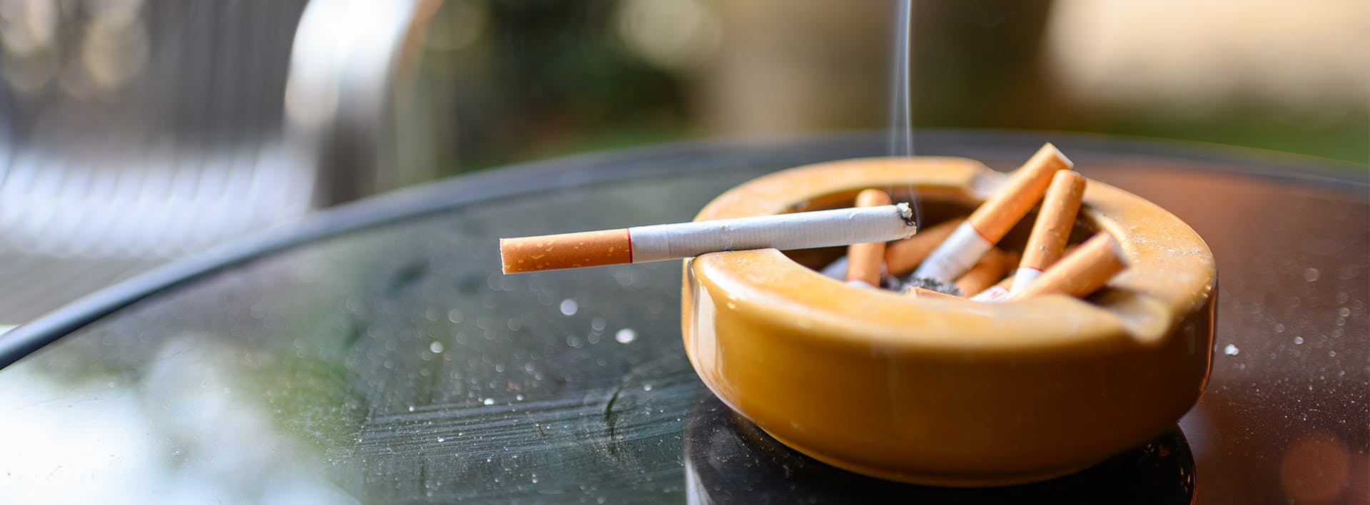 there is a cigarette in a cigarette holder on a table