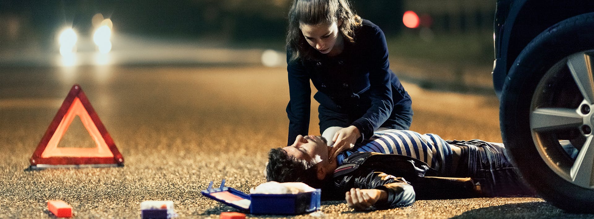man laying on the ground next to a woman who is laying on the ground