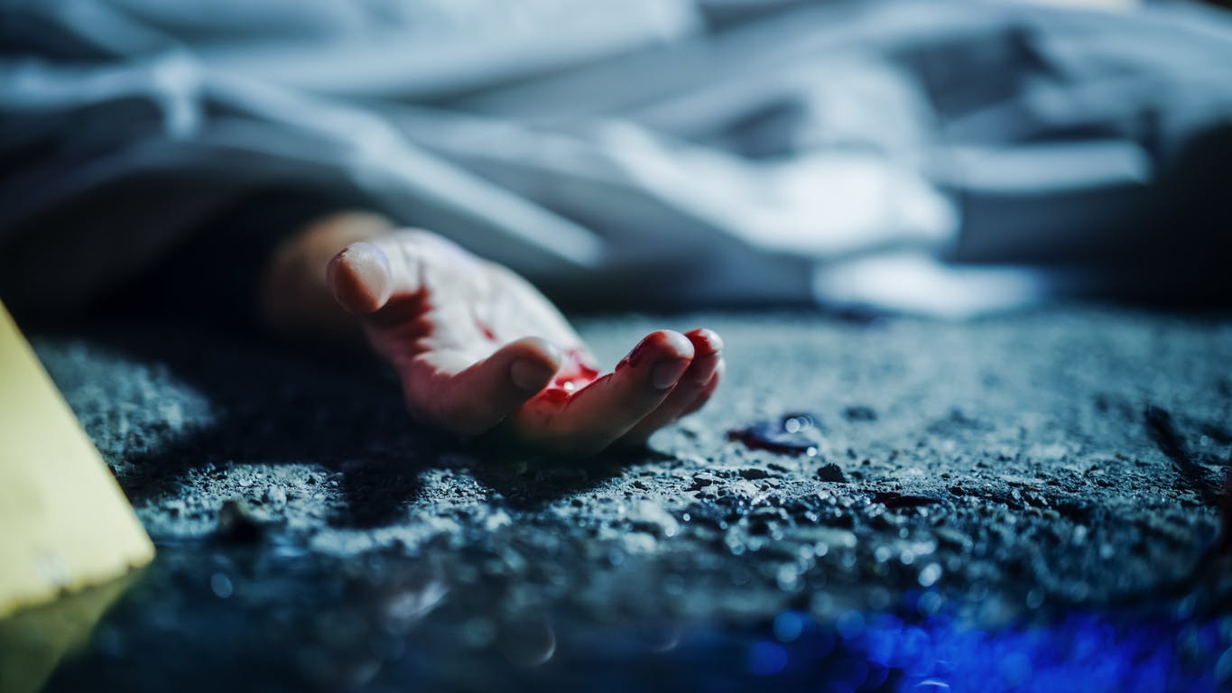 A close-up of the hand of an injured person