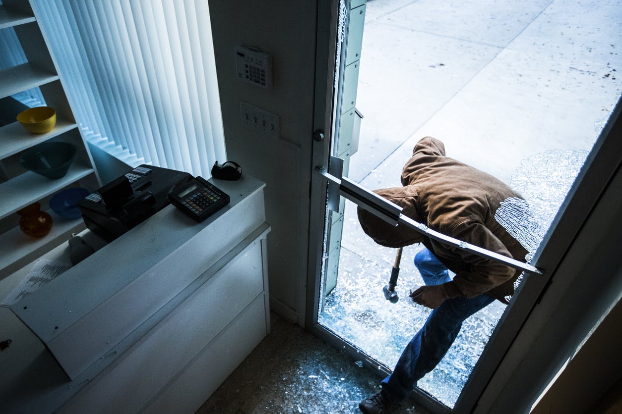 Person breaking into a building