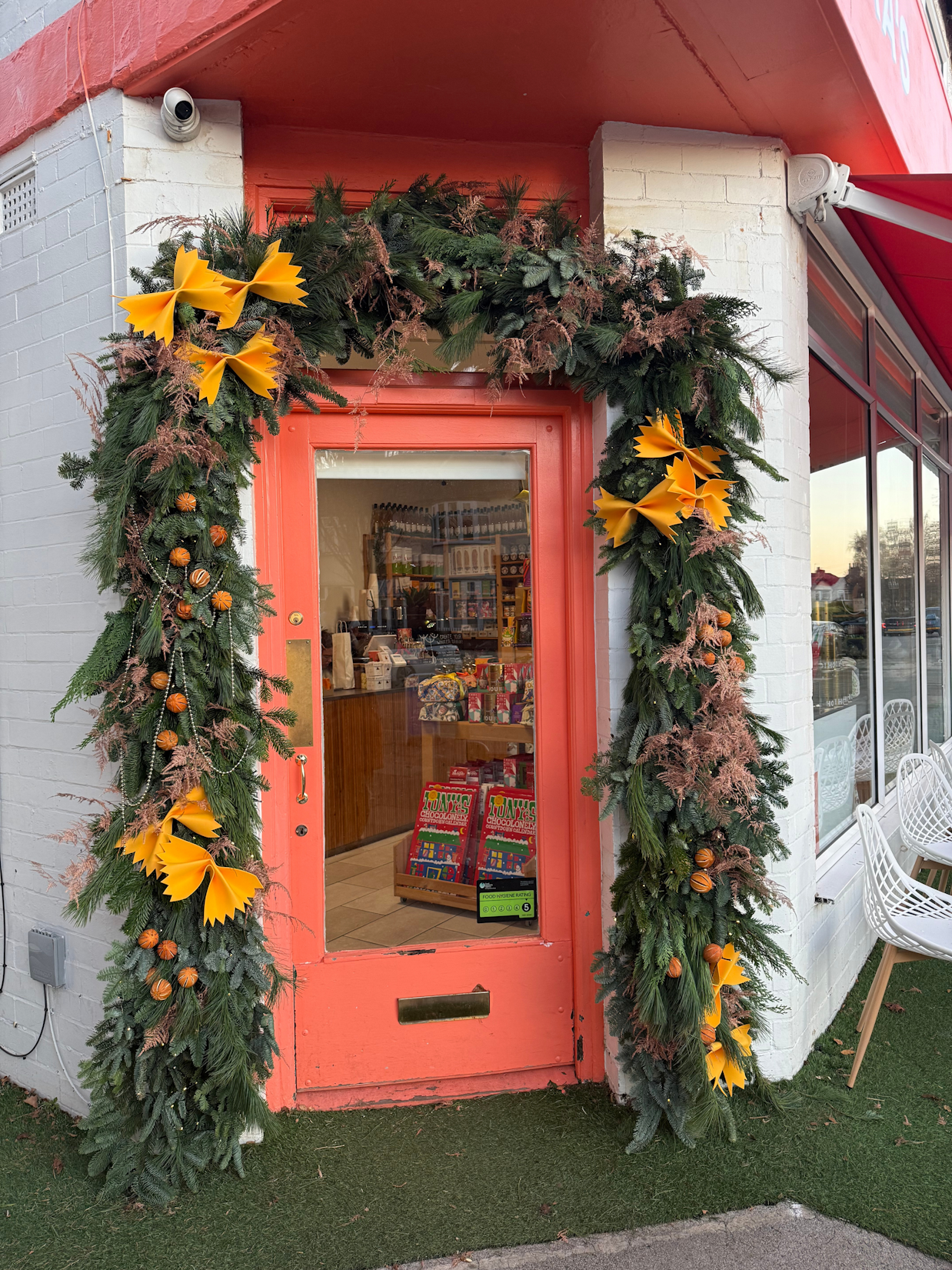 A striking commercial Christmas window display, installed for a local business to attract winter foot traffic.