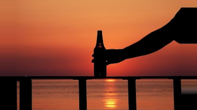 Beer bottle in the sunset