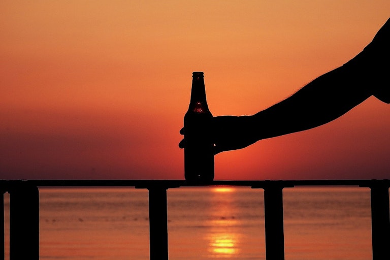 Beer bottle in the sunset
