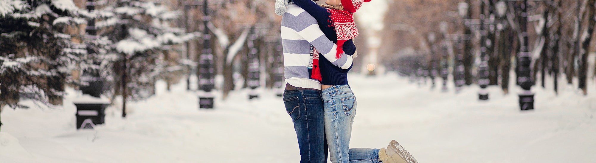Couple Hugging in Snowy Forest