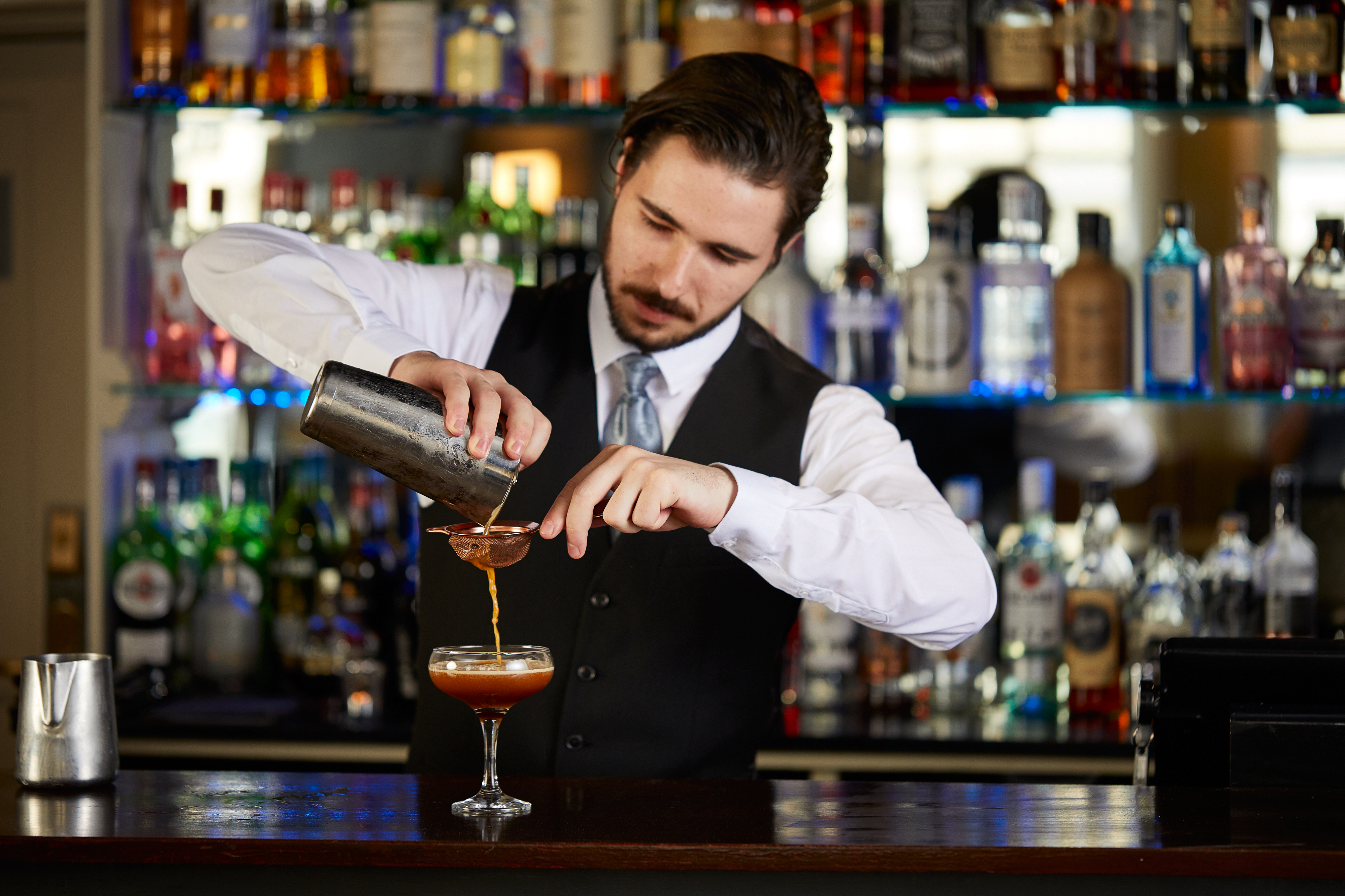Bar Man pouring Cocktails