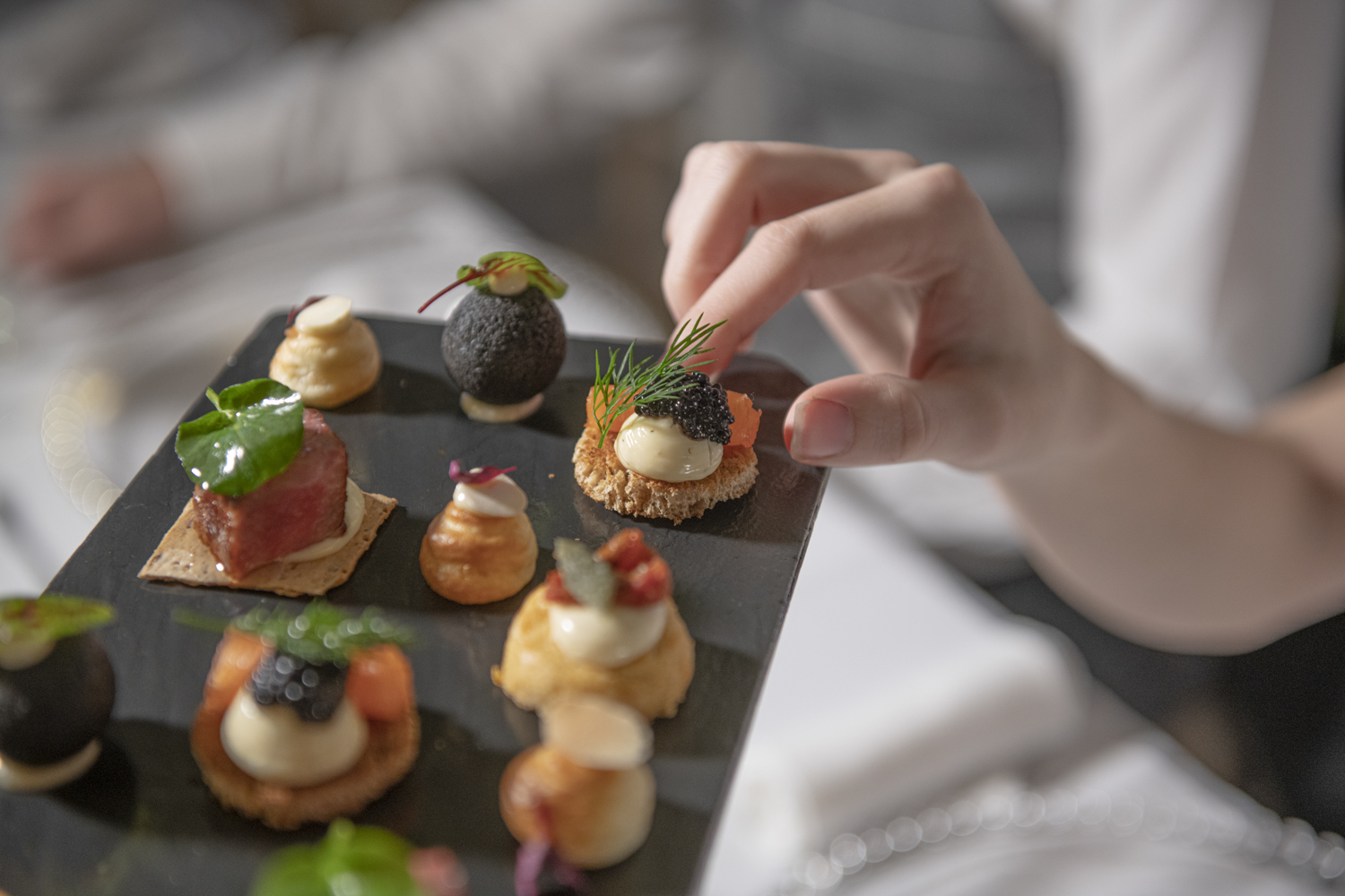 Event canapes on a grey serving plate