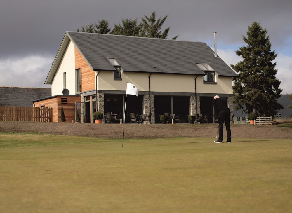 Clubhouse with golfer