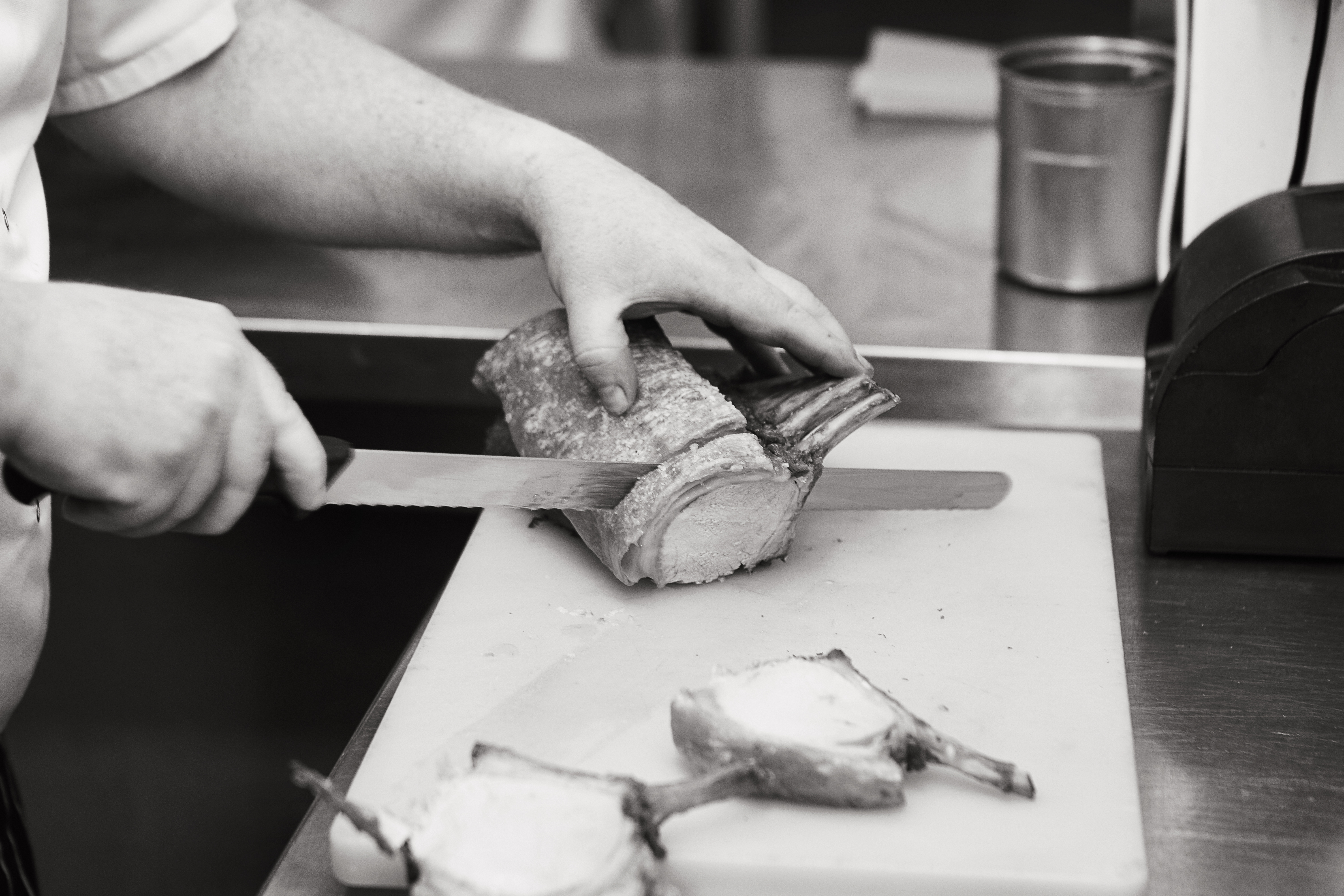 Chef carving roast pork