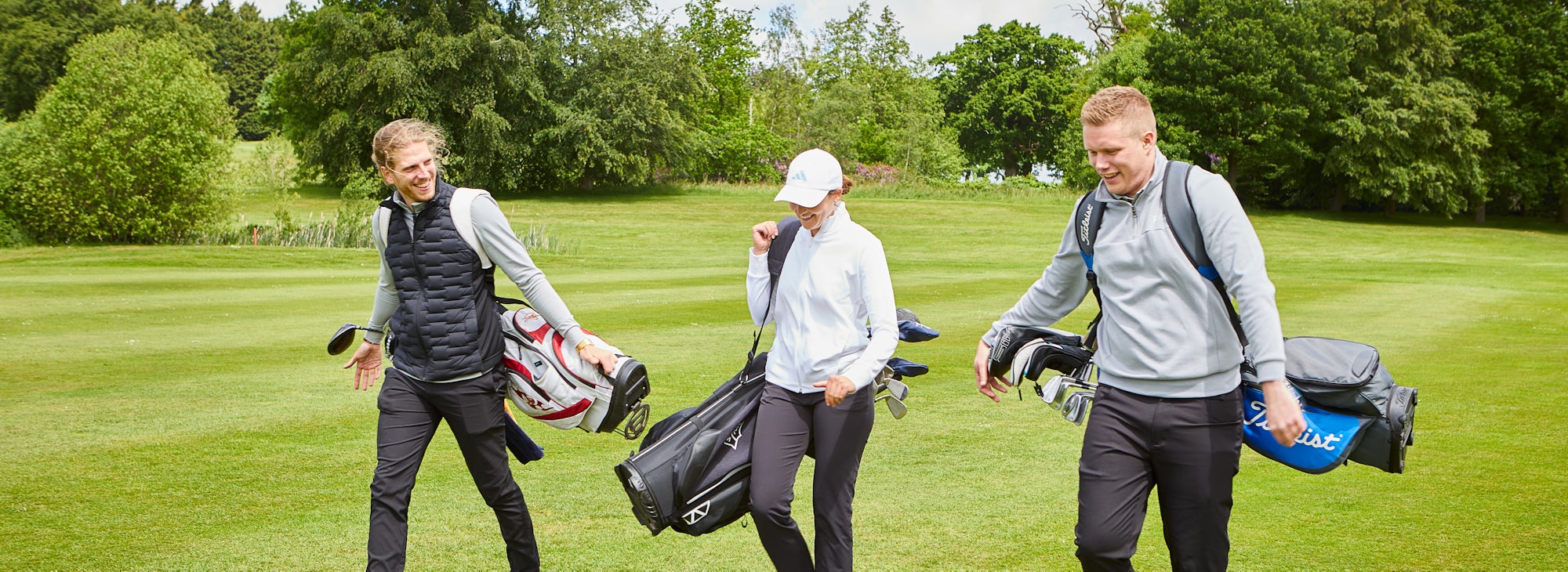 3 players on fairway 3 players on fairway