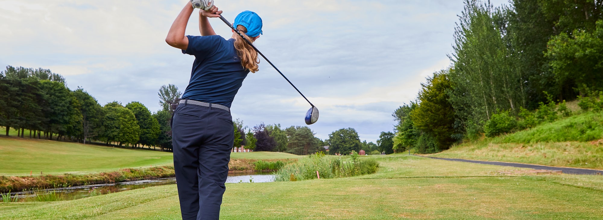 Young golfer at Hill Valler Young golfer driving at Hill Valley
