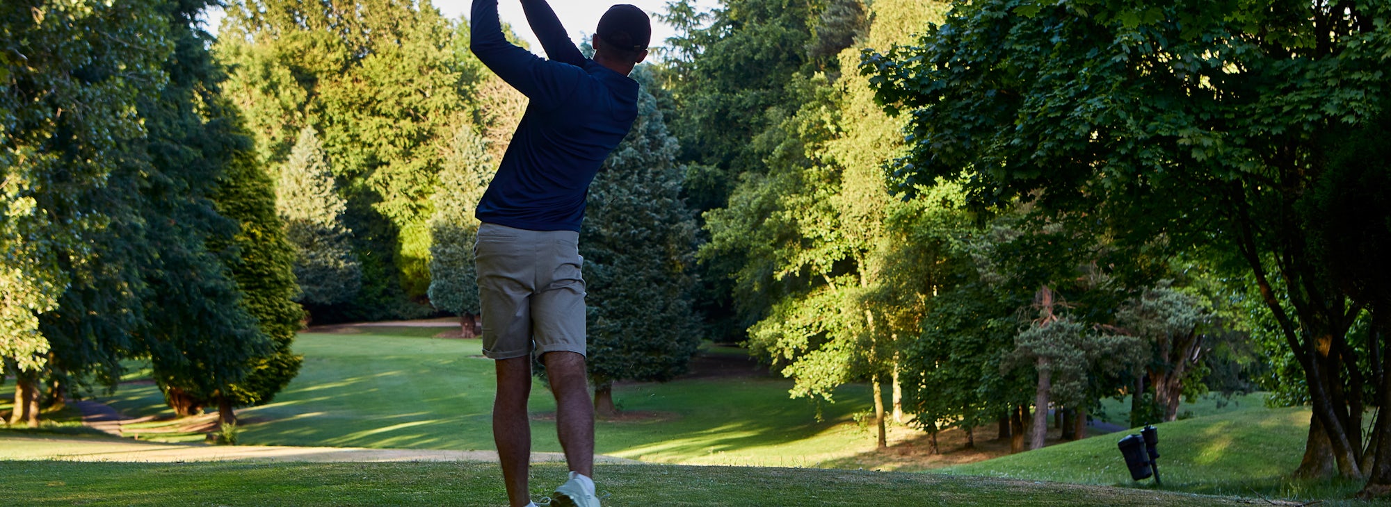Hill Valley Golfer Golfer hitting the ball of the tee
